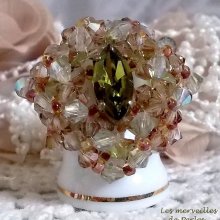 Veronese ring with facets, spinning tops and a Swarovski crystal shuttle